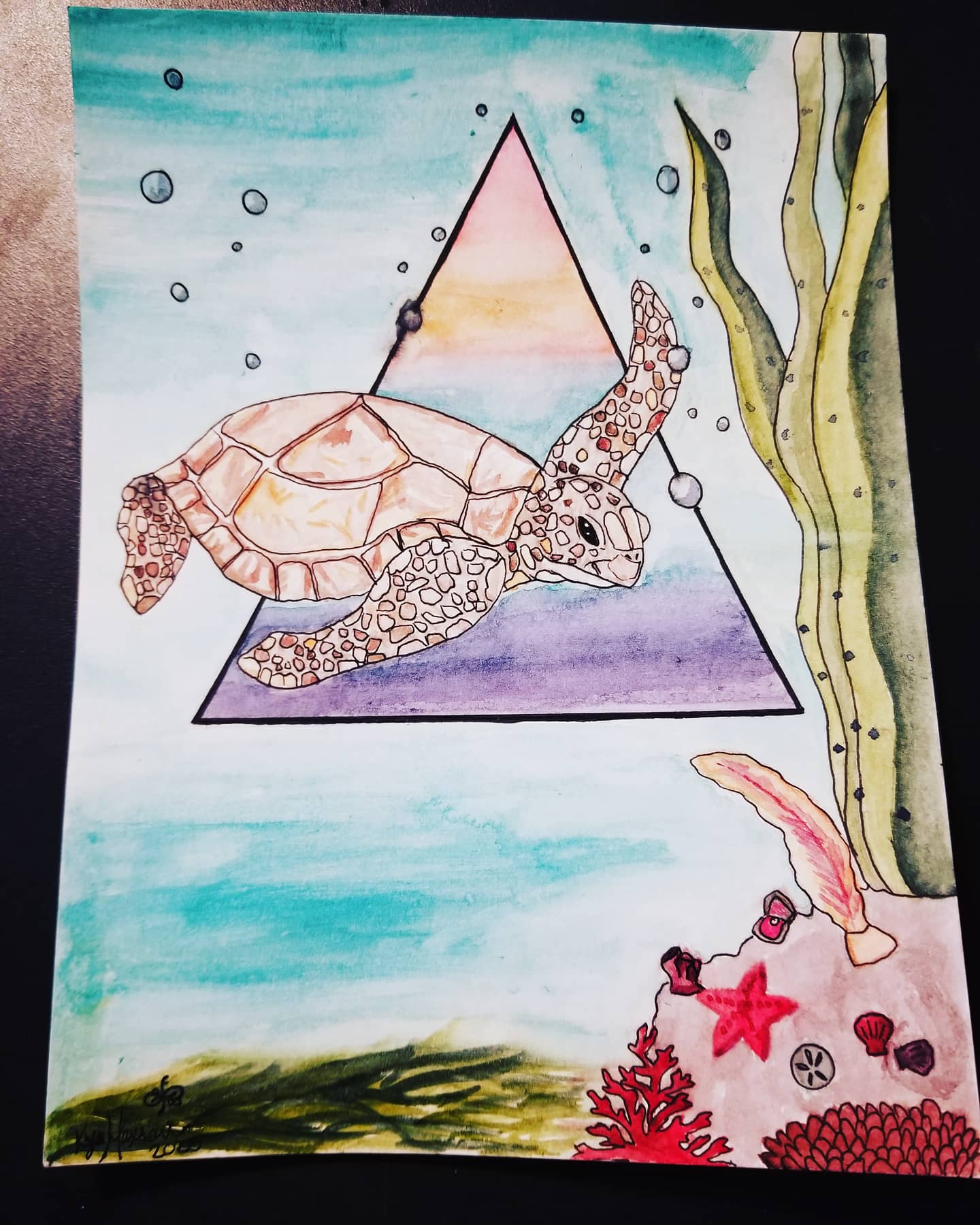 Watercolor and ink illustration of a sea turtle swimming past a geometric triangle, with coral and sea life below